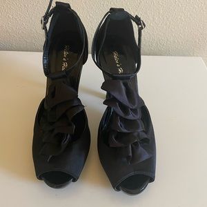 Black satin ruffle heels with ankle strap. 4 inch heel. Size 6.